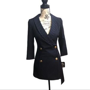 Navy blue blazer dress with gold accessories